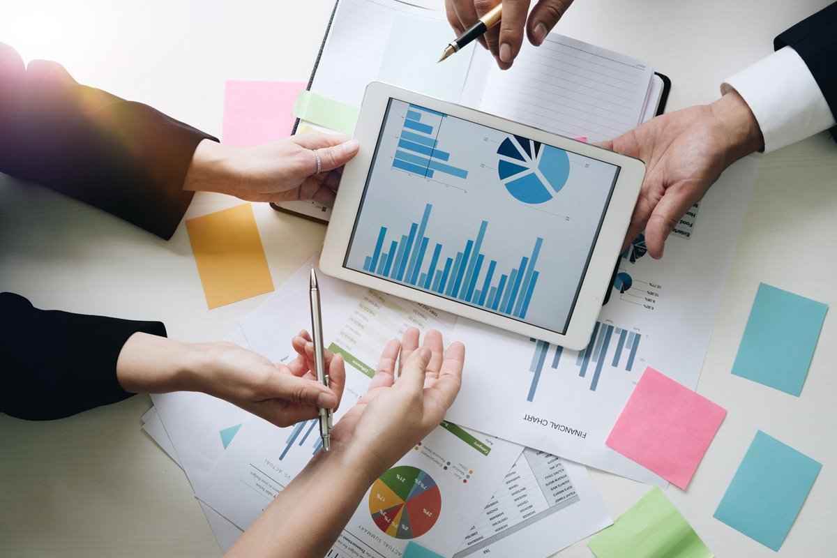 Business team hands at working with financial plan, meeting, discussion, brainstrom with tablet on office desk, Top view shot.